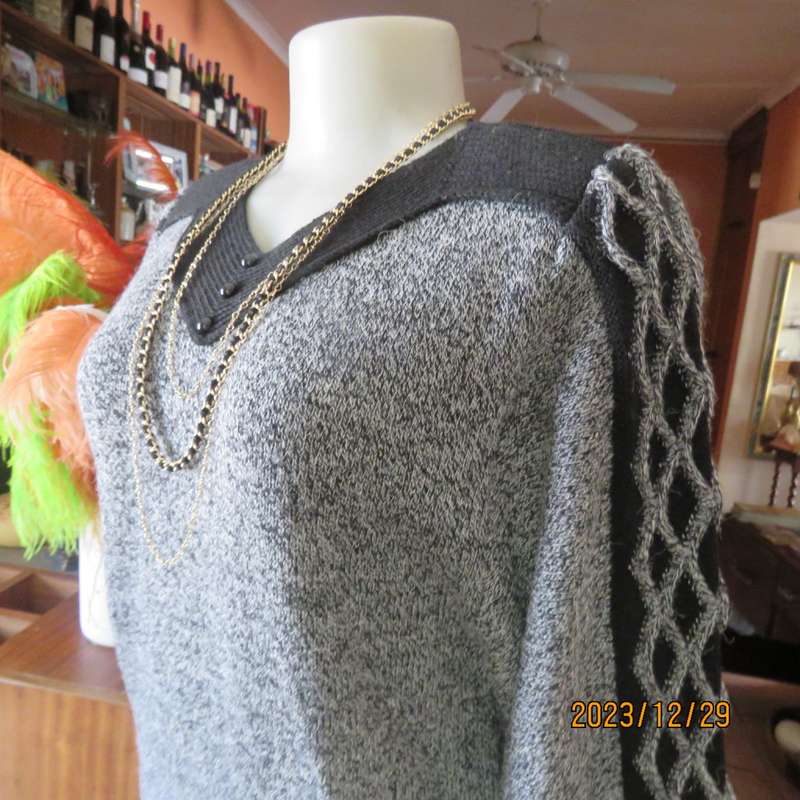 Go for effortless style. Wool/acrylic/cotton blend low calf  knitted dress. By FUJIKI size 34.As new