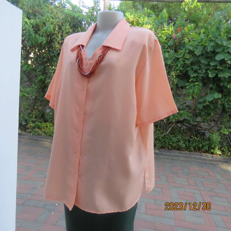 Beautiful soft peach colour button down short sleeve silky polyester top. Size 40 by TOGETHER.As new