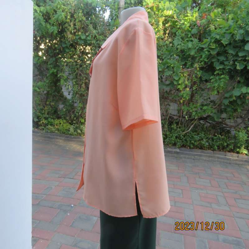 Beautiful soft peach colour button down short sleeve silky polyester top. Size 40 by TOGETHER.As new