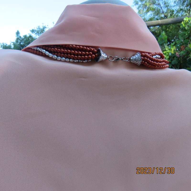 Beautiful soft peach colour button down short sleeve silky polyester top. Size 40 by TOGETHER.As new