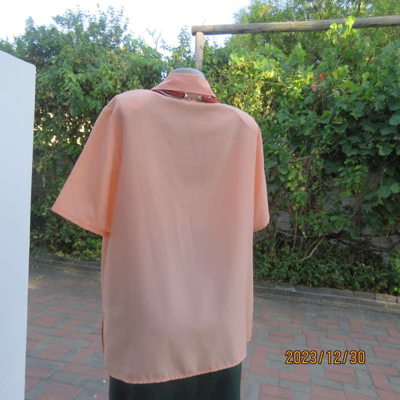 Beautiful soft peach colour button down short sleeve silky polyester top. Size 40 by TOGETHER.As new