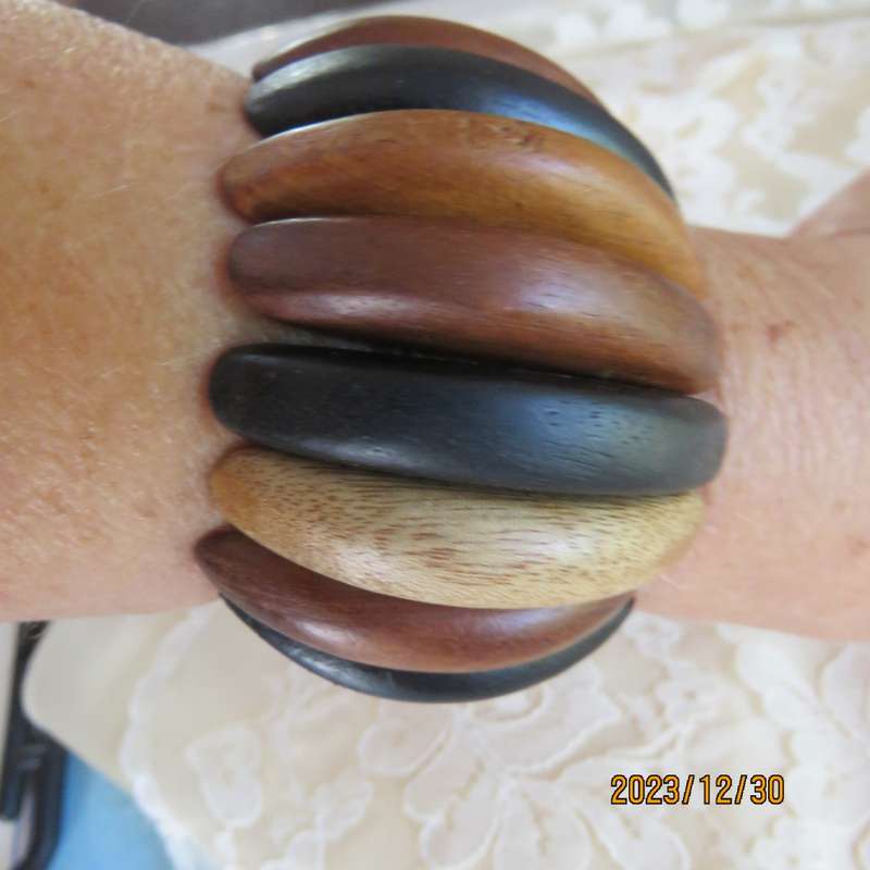 Stunning wooden stretch bracelet made up of different woods. Width 5cm. New condition.