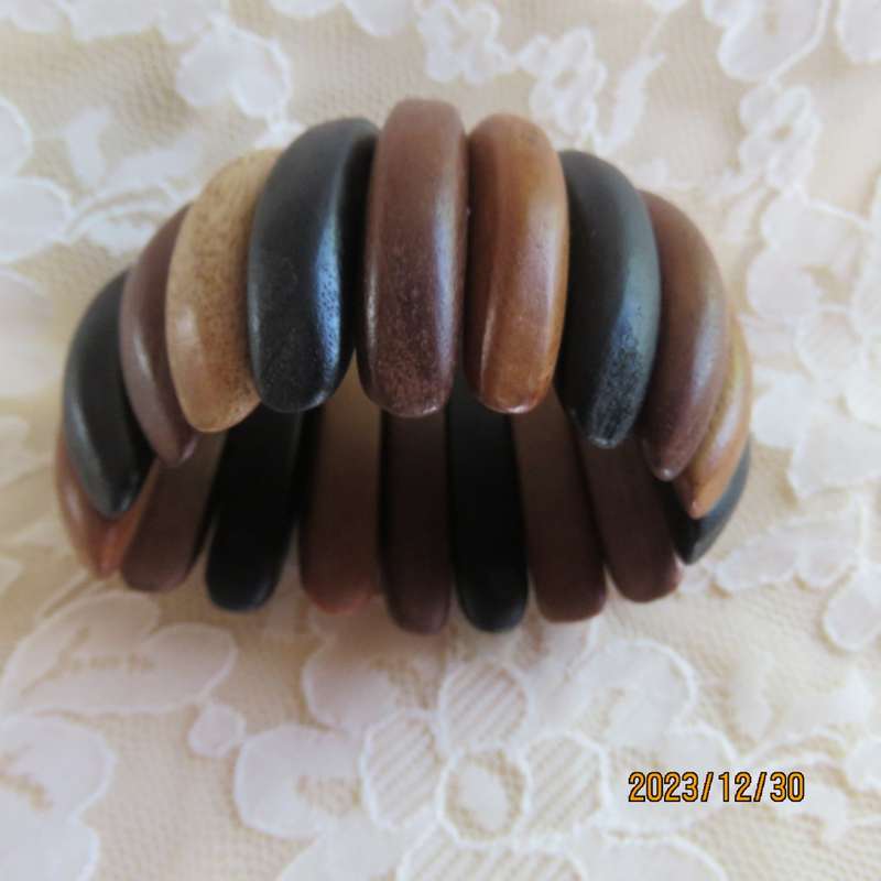Stunning wooden stretch bracelet made up of different woods. Width 5cm. New condition.