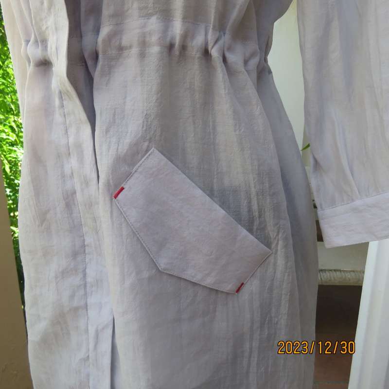 Smart long creased poly/nylon silvergrey zip up top with waist drawstring.From Japan size 36.New con