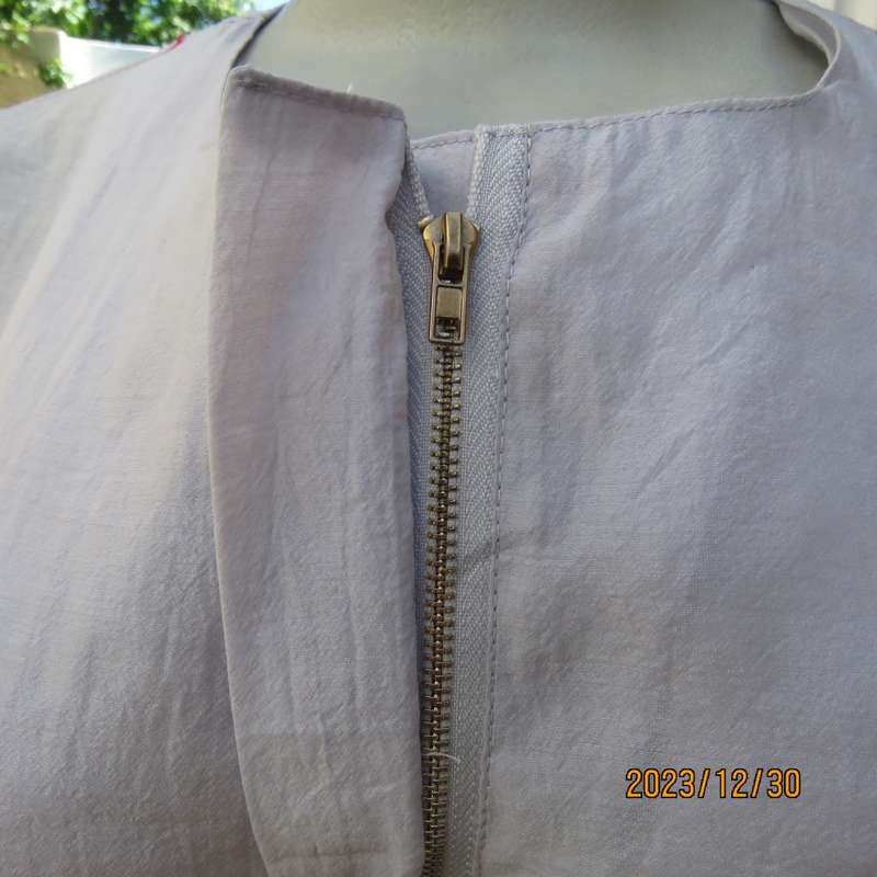 Smart long creased poly/nylon silvergrey zip up top with waist drawstring.From Japan size 36.New con