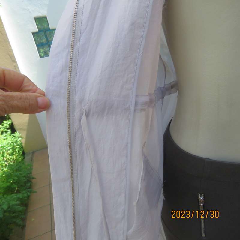 Smart long creased poly/nylon silvergrey zip up top with waist drawstring.From Japan size 36.New con