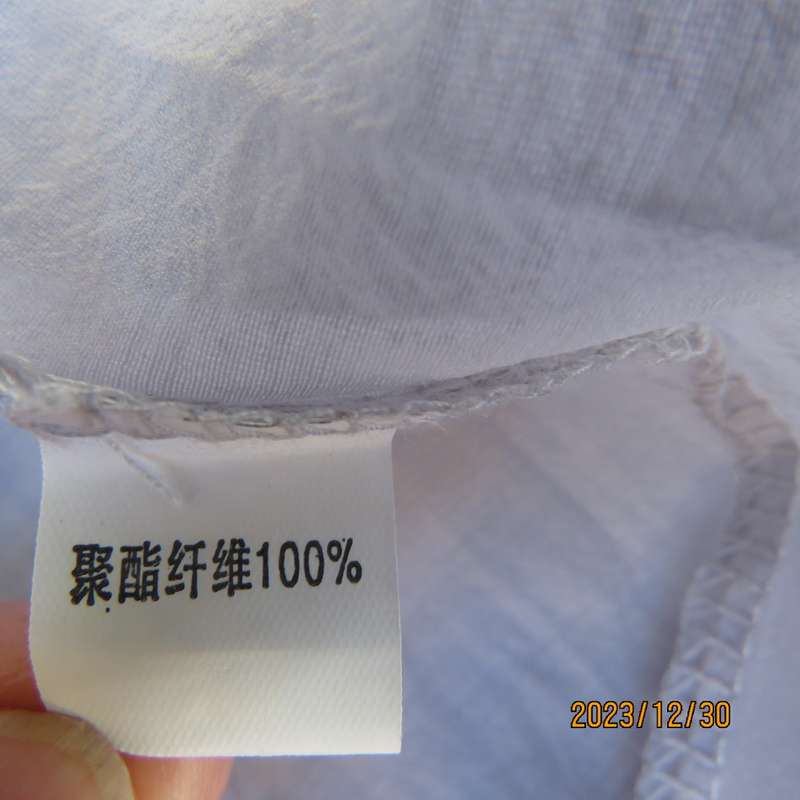 Smart long creased poly/nylon silvergrey zip up top with waist drawstring.From Japan size 36.New con