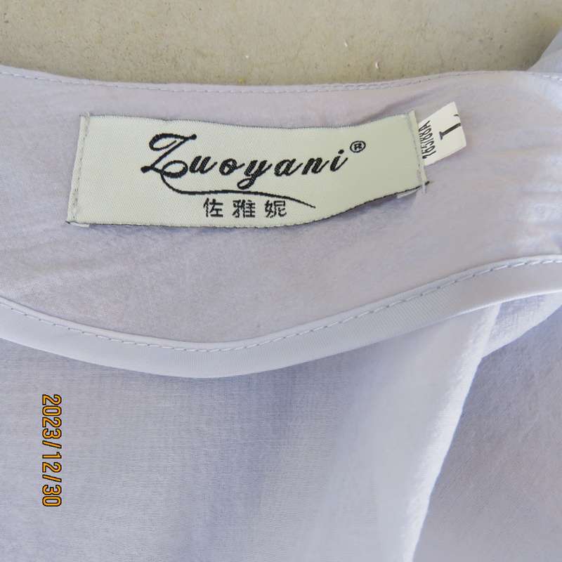 Smart long creased poly/nylon silvergrey zip up top with waist drawstring.From Japan size 36.New con