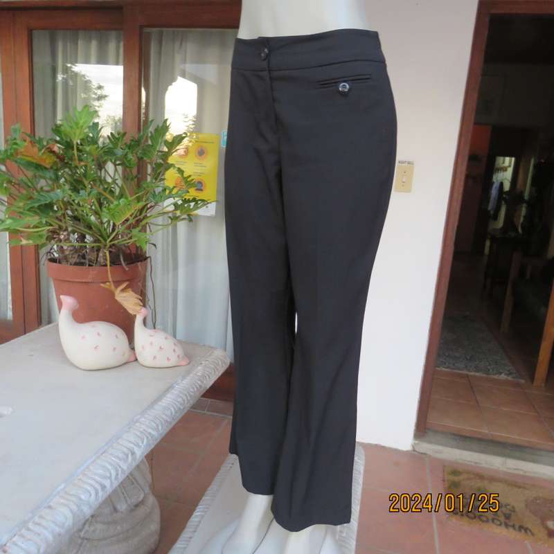 Very black bootlegged smart WOOLWORTHS polyester pants size 36/12. Inner leg 73cm. As new.