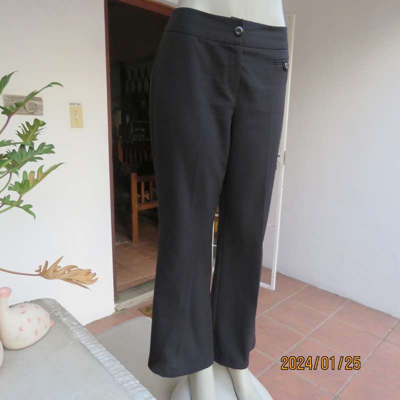 Very black bootlegged smart WOOLWORTHS polyester pants size 36/12. Inner leg 73cm. As new.