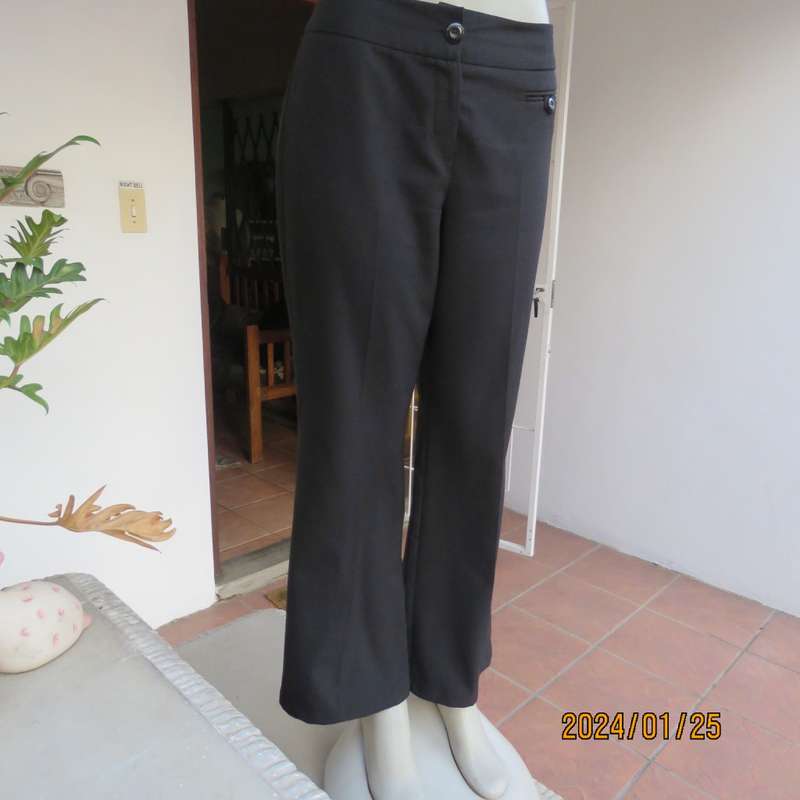 Very black bootlegged smart WOOLWORTHS polyester pants size 36/12. Inner leg 73cm. As new.