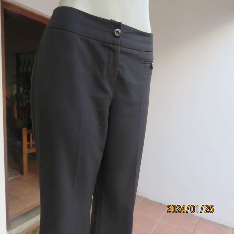 Very black bootlegged smart WOOLWORTHS polyester pants size 36/12. Inner leg 73cm. As new.