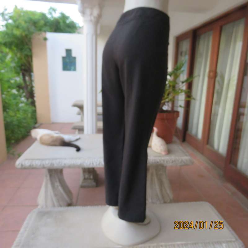 Very black bootlegged smart WOOLWORTHS polyester pants size 36/12. Inner leg 73cm. As new.