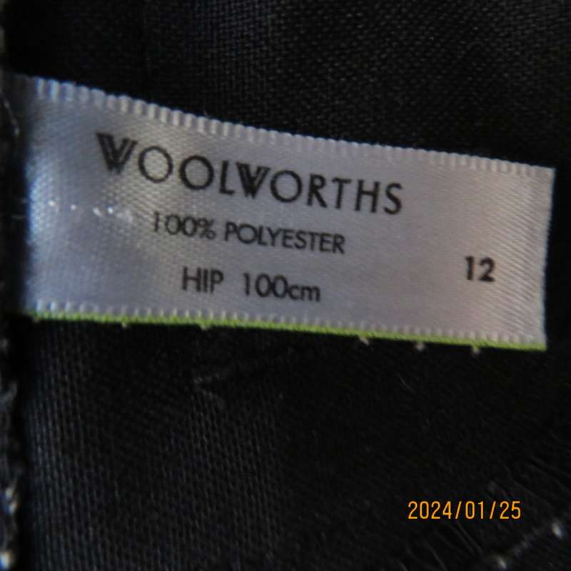 Very black bootlegged smart WOOLWORTHS polyester pants size 36/12. Inner leg 73cm. As new.