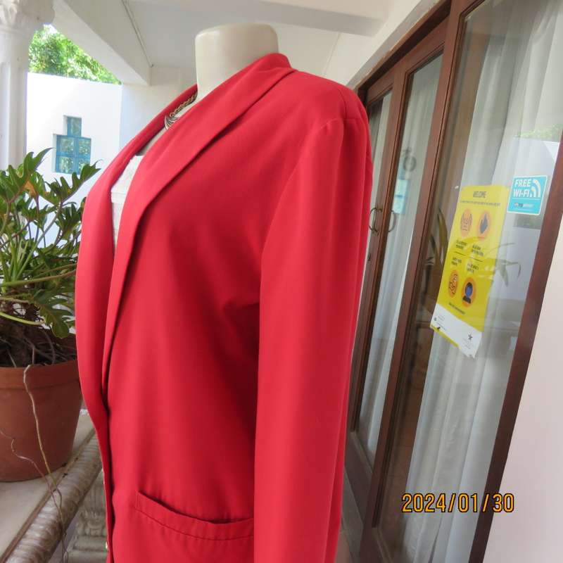 Get noticed in this carmine red long sleeve 3 button jacket with shawl collar.Size 38 to 40. As new