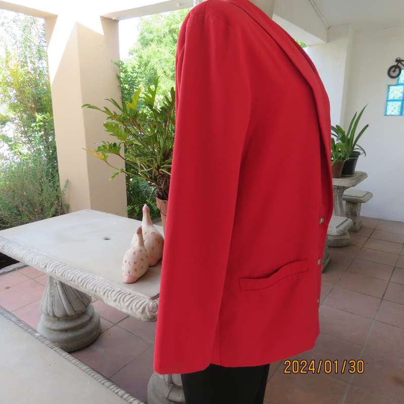 Get noticed in this carmine red long sleeve 3 button jacket with shawl collar.Size 38 to 40. As new