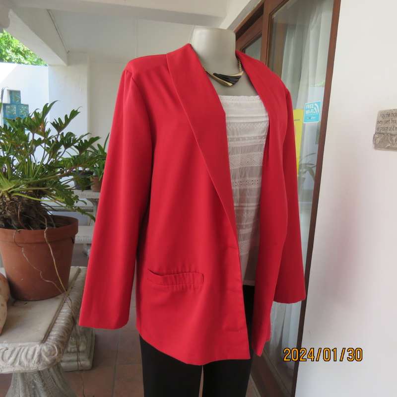 Get noticed in this carmine red long sleeve 3 button jacket with shawl collar.Size 38 to 40. As new