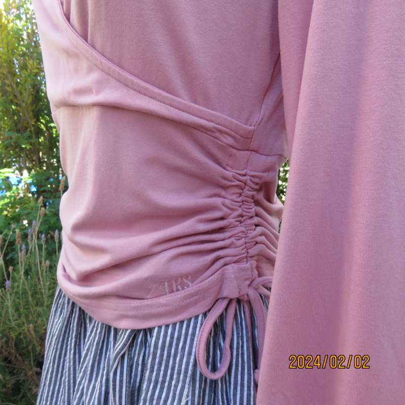 On trend blush pink empire waist cropped cross over top with side drawstrings. Size 36 by TRU.As new