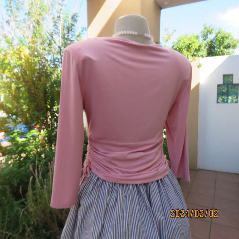 On trend blush pink empire waist cropped cross over top with side drawstrings. Size 36 by TRU.As new