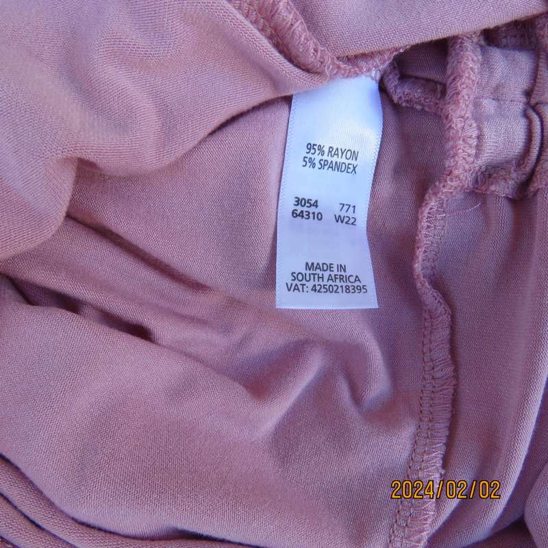 On trend blush pink empire waist cropped cross over top with side drawstrings. Size 36 by TRU.As new