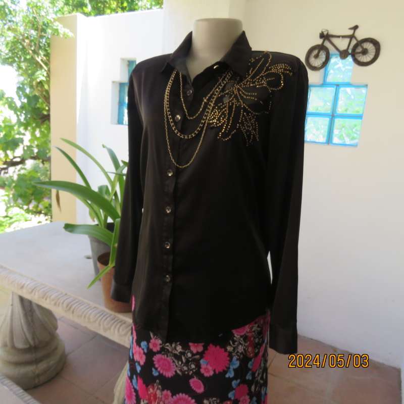 Get noticed in this black silky,shiny stretch poly long sleeve top size 36/38. Luxury embellishment.