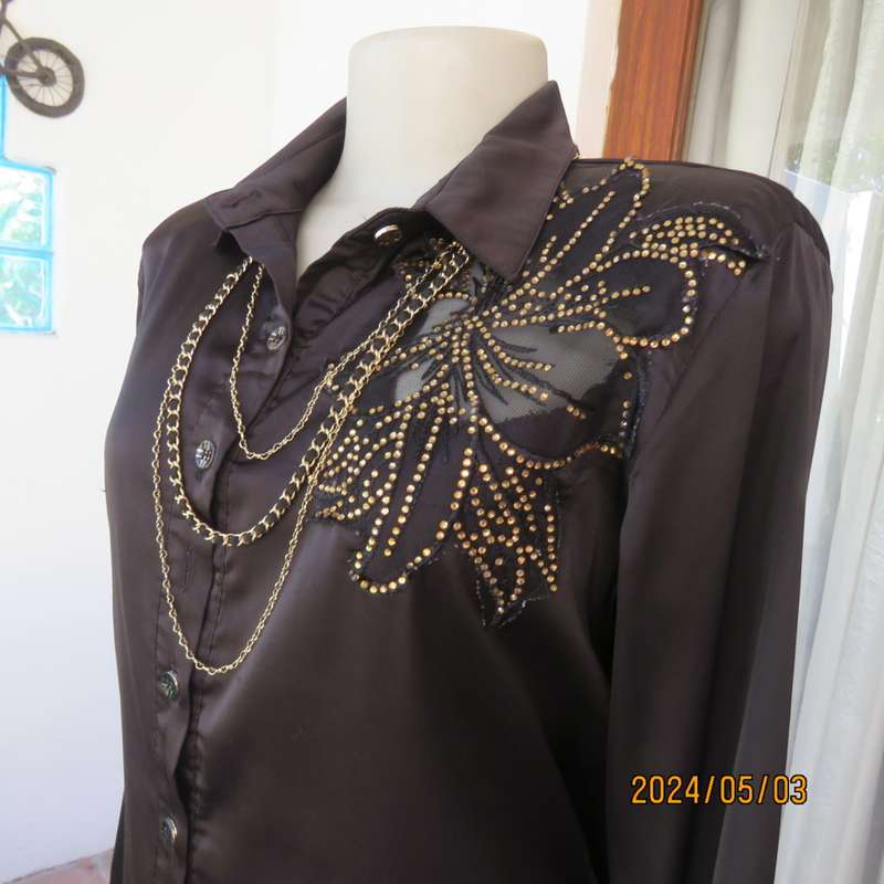 Get noticed in this black silky,shiny stretch poly long sleeve top size 36/38. Luxury embellishment.
