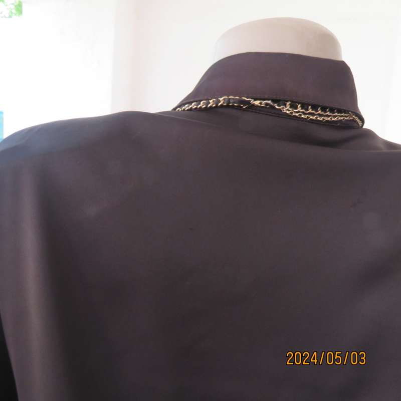 Get noticed in this black silky,shiny stretch poly long sleeve top size 36/38. Luxury embellishment.