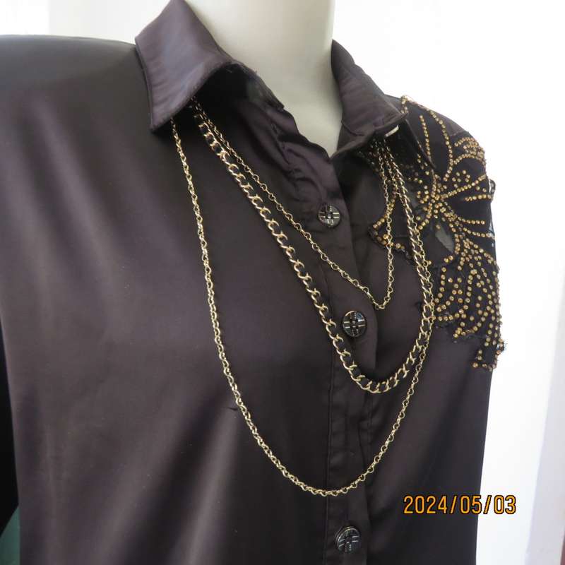 Get noticed in this black silky,shiny stretch poly long sleeve top size 36/38. Luxury embellishment.