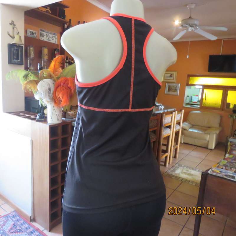 Pretty sport stretch poly sleeveless black/grey with polkadots and crimson edging .Size 32/34