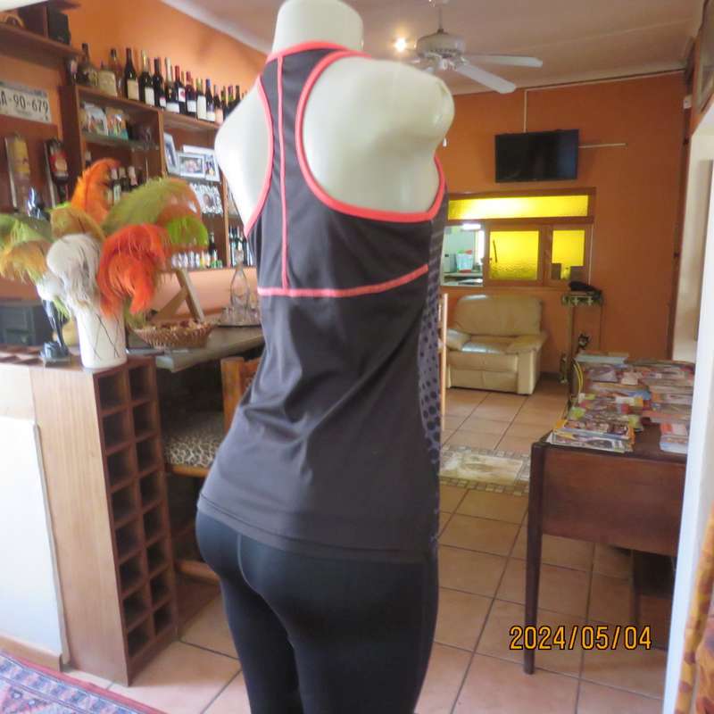 Pretty sport stretch poly sleeveless black/grey with polkadots and crimson edging .Size 32/34