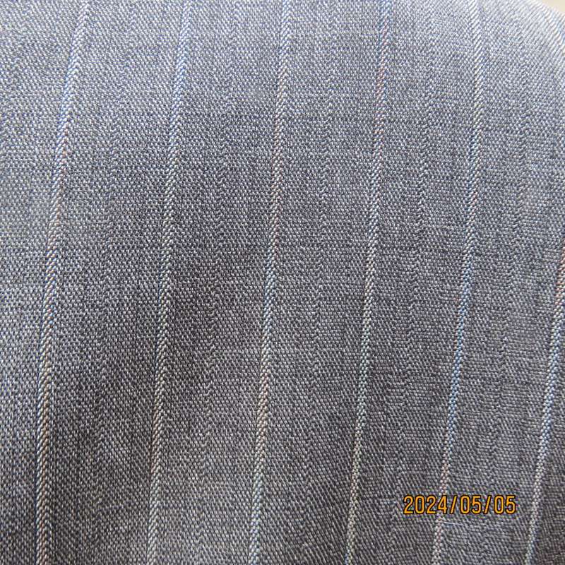 Elegant slate grey long sleeve striped jacket in lighter shades. By FINNEGANS size 42. Brand new con