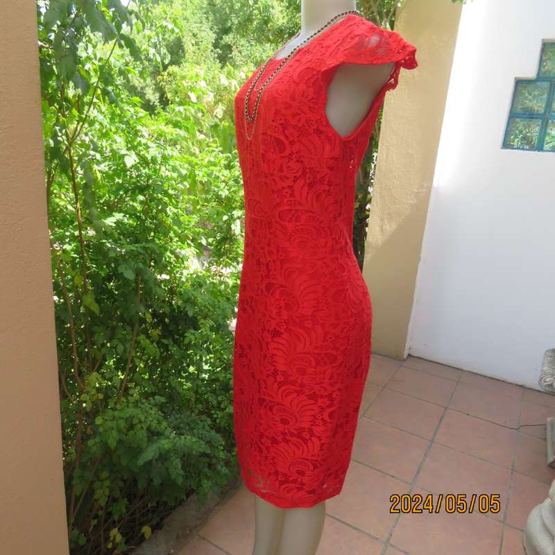 Fired up in red lace!!. Stunning red dress in stretch poly with lace. Long back zip.Tiny sleeves.34.