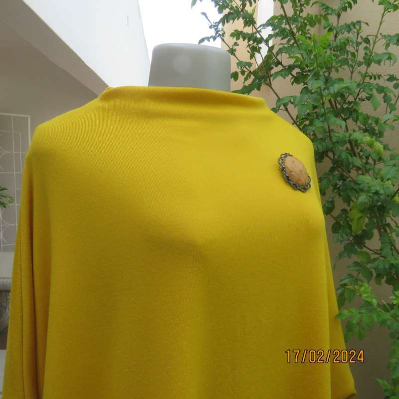 What not to like about this amber yellow warm polyknit top! Dolman sleeves. High cut neckline. 48/50
