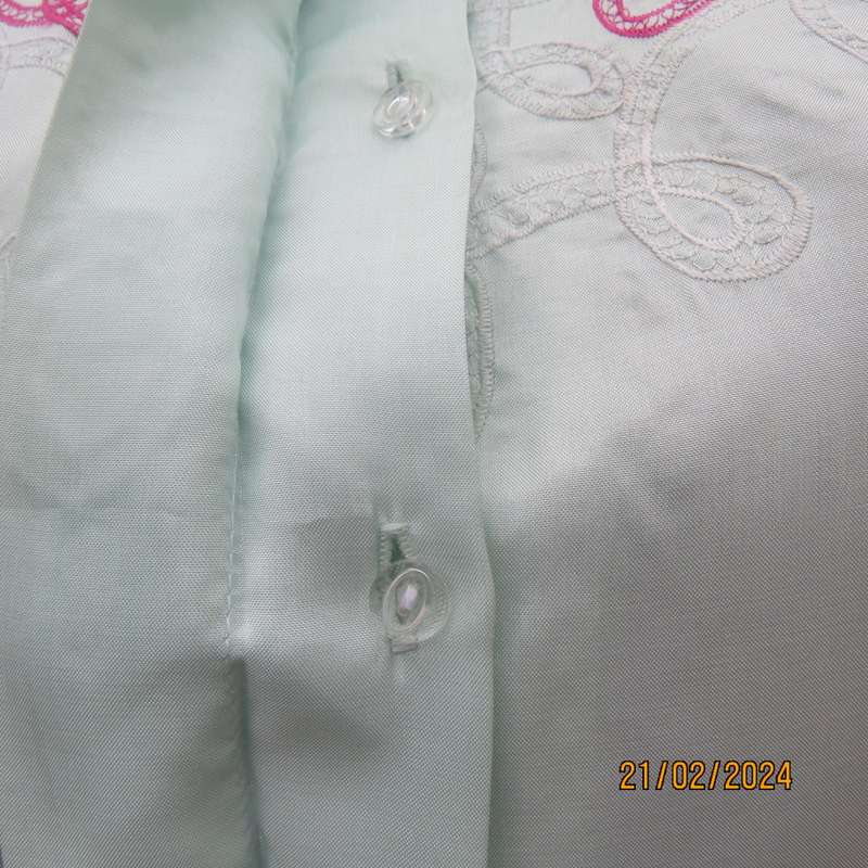 Amazing mint green silk blouse with short sleeves . Hidden button down.Luxe embroidery.By BONITA 35.