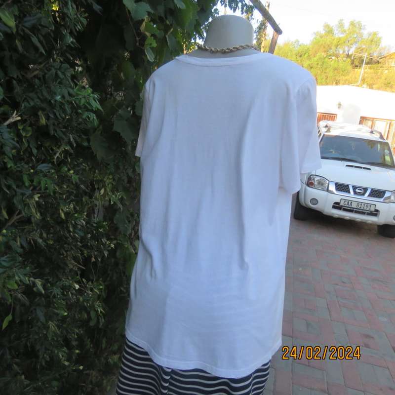 Cute white maternity T Shirt with short sleeves. Logo...YOU AND ME BABY...in gold. Size 40. As new