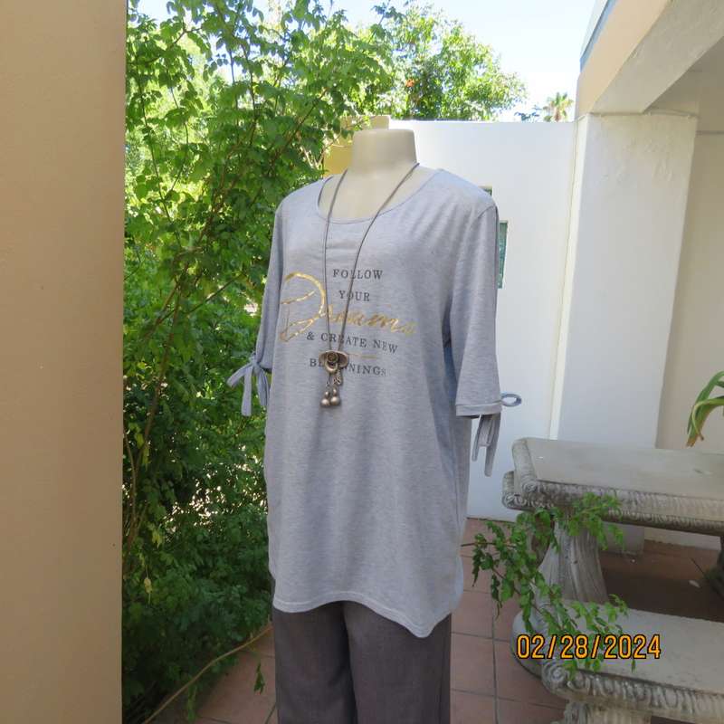 Oversized size 38 silvergrey open shoulder T Shirt. Gold/black logo. Tiestring on sleeve hems.