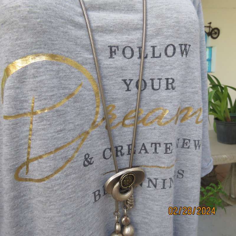 Oversized size 38 silvergrey open shoulder T Shirt. Gold/black logo. Tiestring on sleeve hems.
