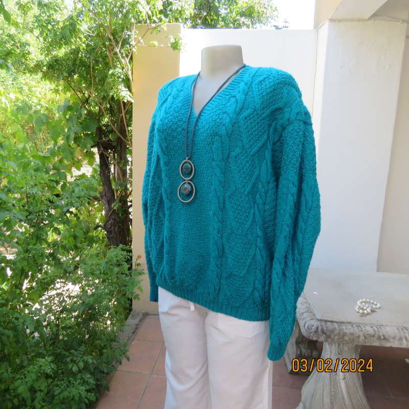 Chunky hand knitted caribbean turquoise pullover cardigan. Knit on long sleeves. Size 40/16.As new