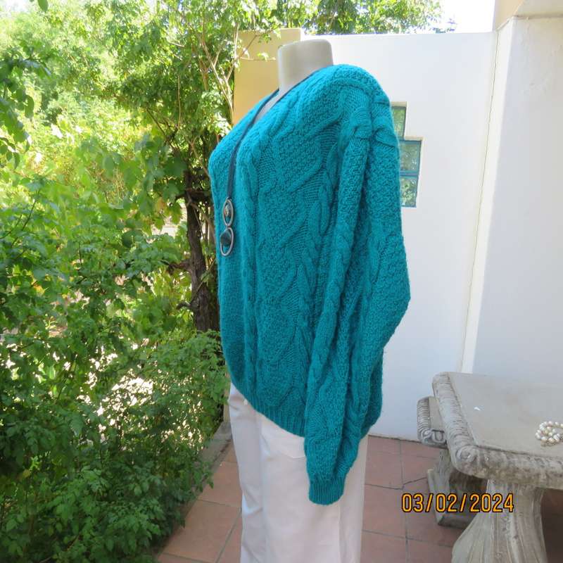 Chunky hand knitted caribbean turquoise pullover cardigan. Knit on long sleeves. Size 40/16.As new