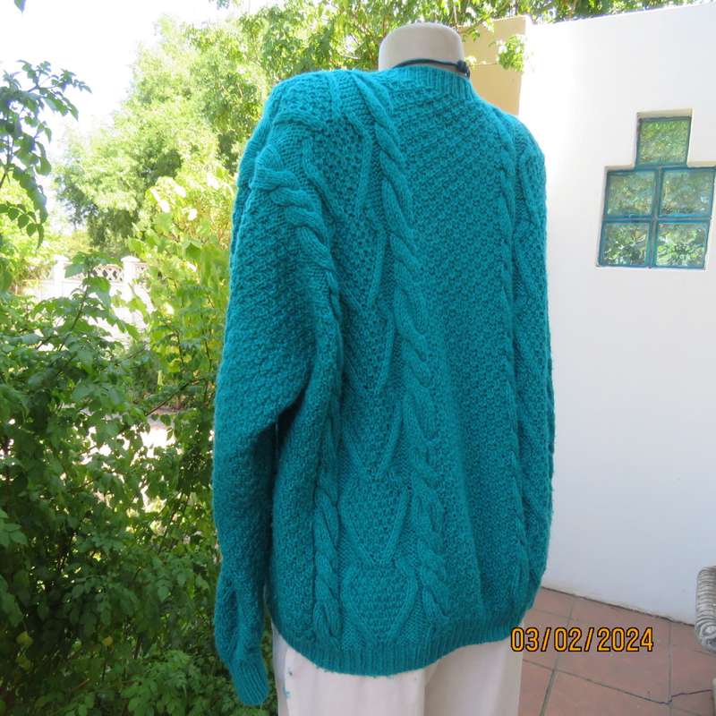 Chunky hand knitted caribbean turquoise pullover cardigan. Knit on long sleeves. Size 40/16.As new