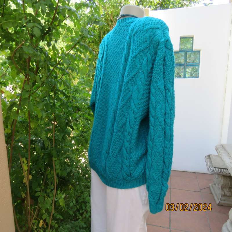 Chunky hand knitted caribbean turquoise pullover cardigan. Knit on long sleeves. Size 40/16.As new