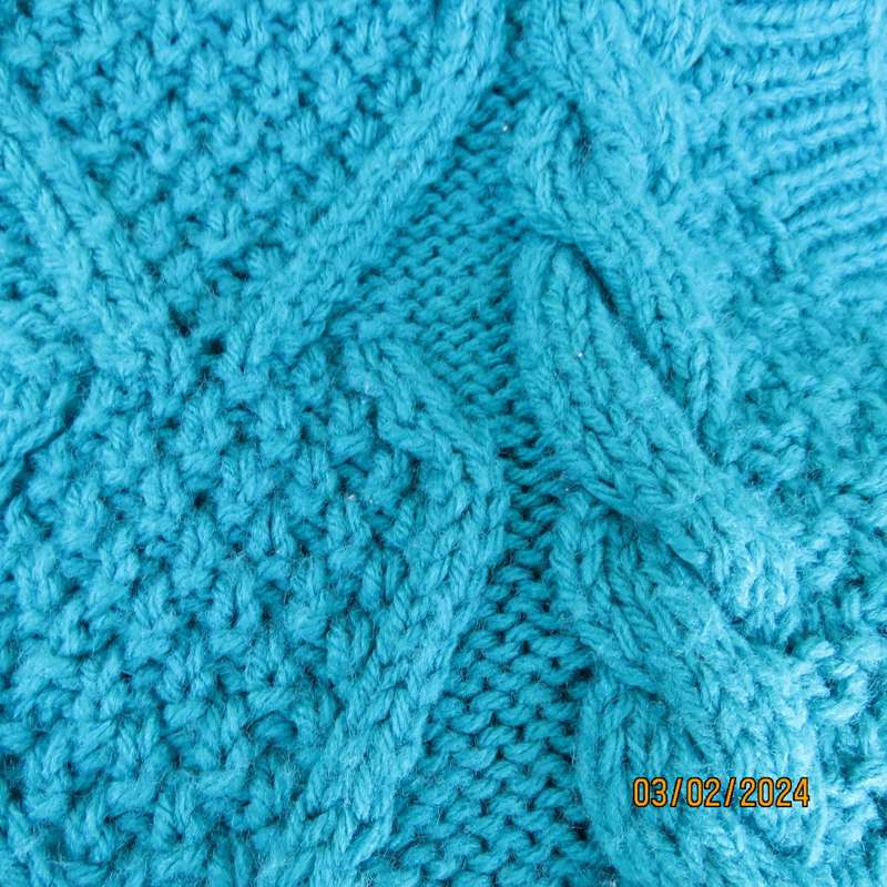 Chunky hand knitted caribbean turquoise pullover cardigan. Knit on long sleeves. Size 40/16.As new