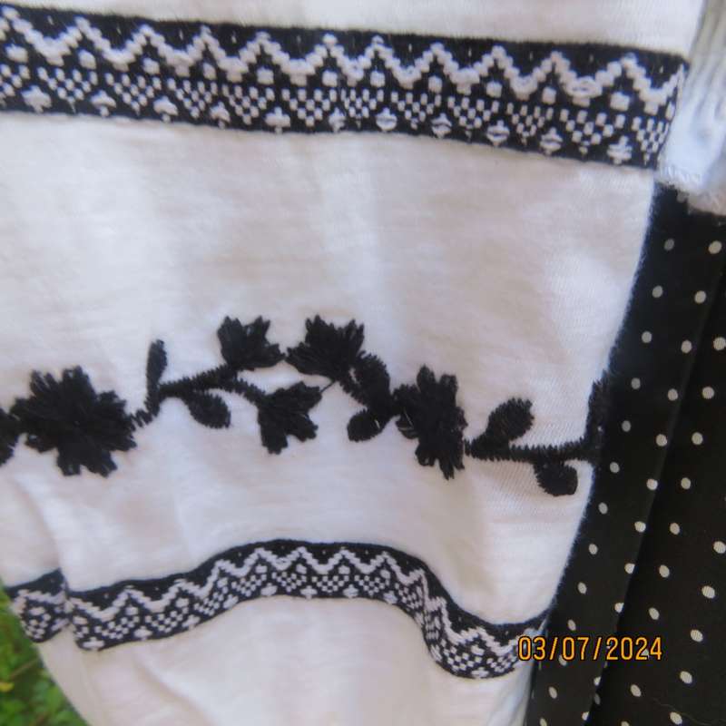 Tasteful black floral embroidered white cotton long sleeve top size 36 by EDITION. As new condition.
