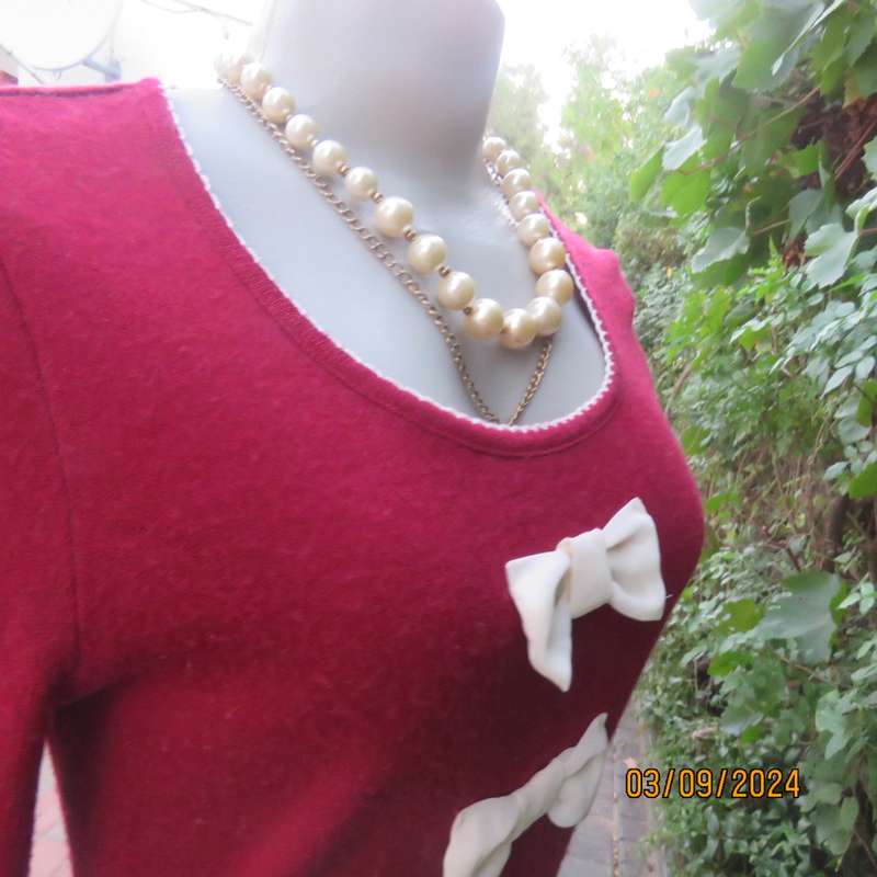 Soft dark red long sleeve angora/acrylic stretch knitted top. Cream fabric bows & frill. Size 34/10
