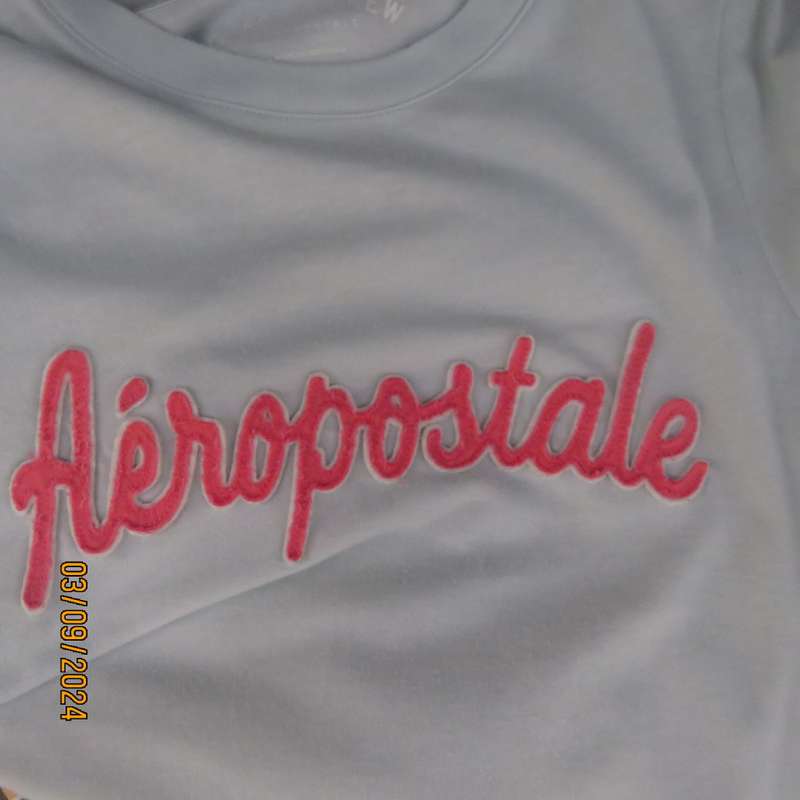 AEROPOSTALE best brand soft green capped sleeve T Shirt size 34. Name stitched on front.