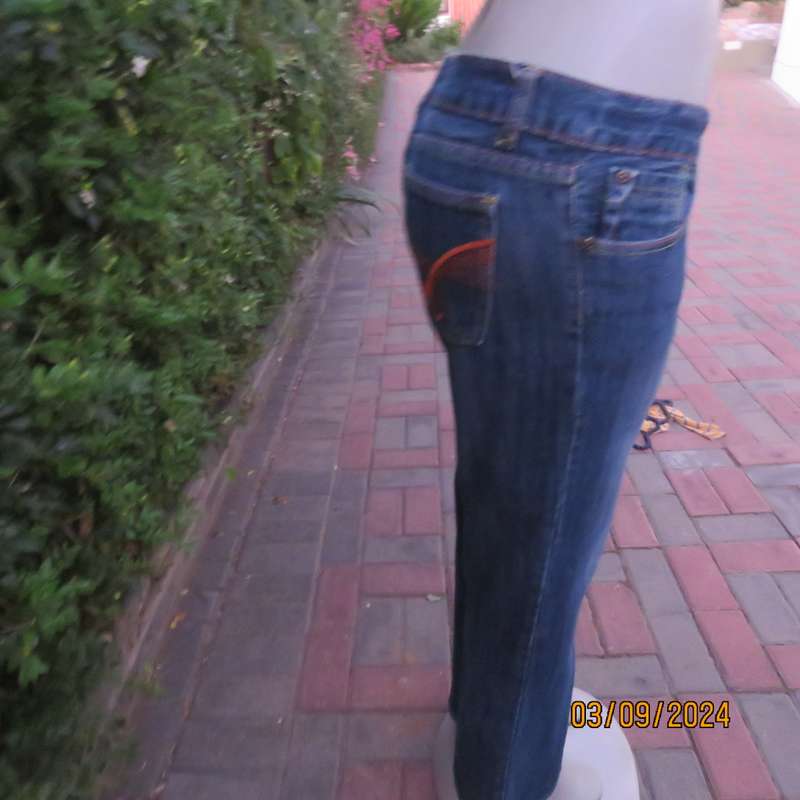 Pair of blue denim cotton Slouch fit low rise jeans by ST BERNARD size 34.Bootlegged. Very good cond