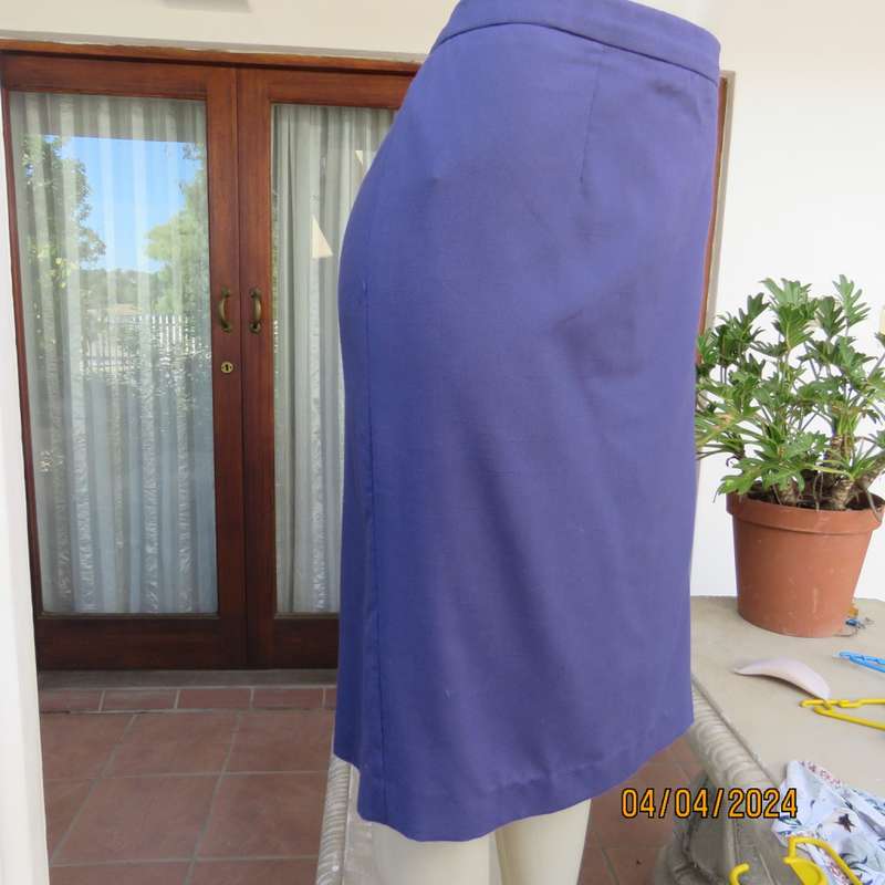 Smart indigo blue 2 pc pencil skirt-open hanging short sleeve jacket. Boutique made size 40.As new