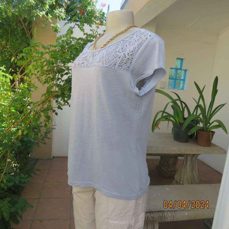 Capped sleeve light blue slip over top with polyester lace yoke. Size 36. Stretch viscose.