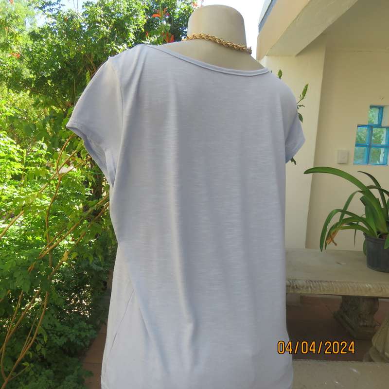 Capped sleeve light blue slip over top with polyester lace yoke. Size 36. Stretch viscose.