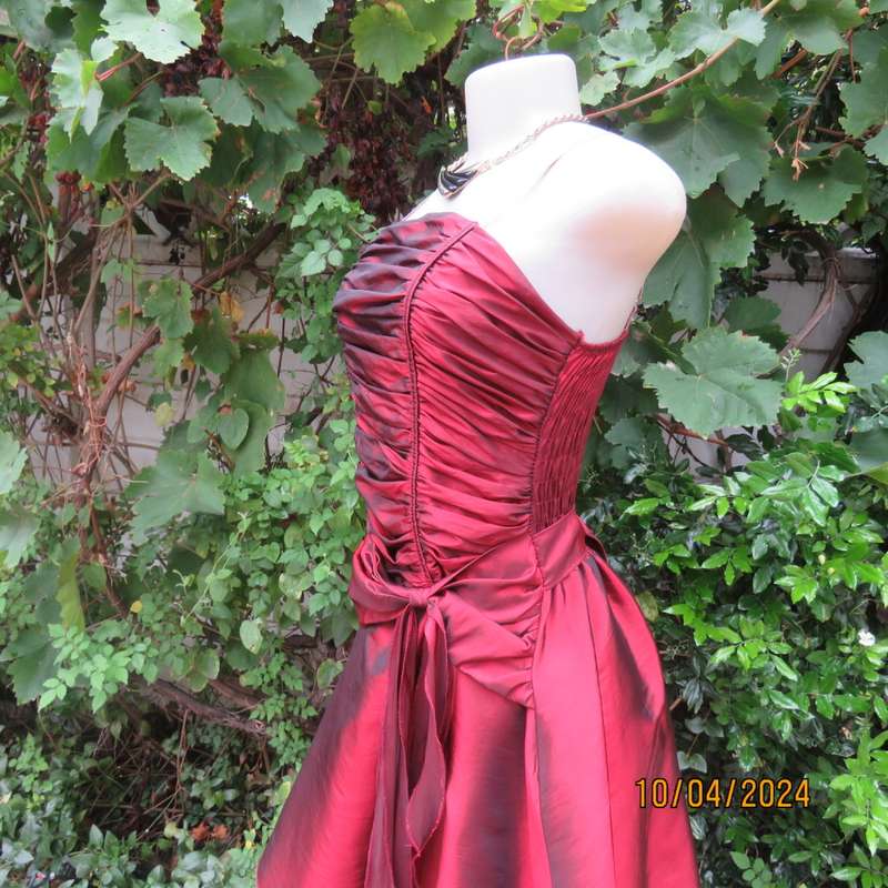 Chic garnet red polyester satin dress. Ruched top front. Skater skirt. Size 36.